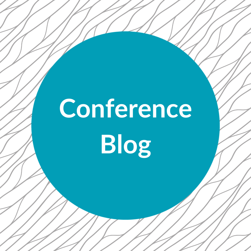 Teal circle with white text reading 'conference blog'